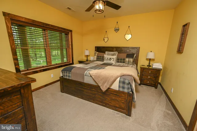 a view of a patio with lawn chairs and a yard