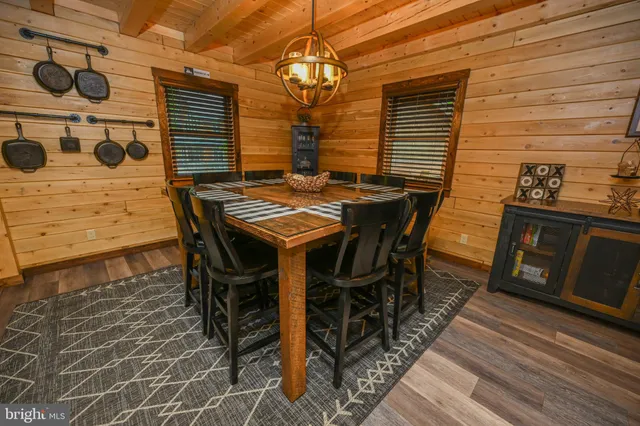 a kitchen with a stove a refrigerator and wooden cabinets