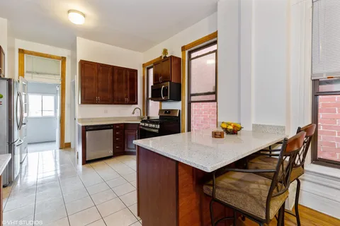 a view of kitchen island with furniture and flat screen tv
