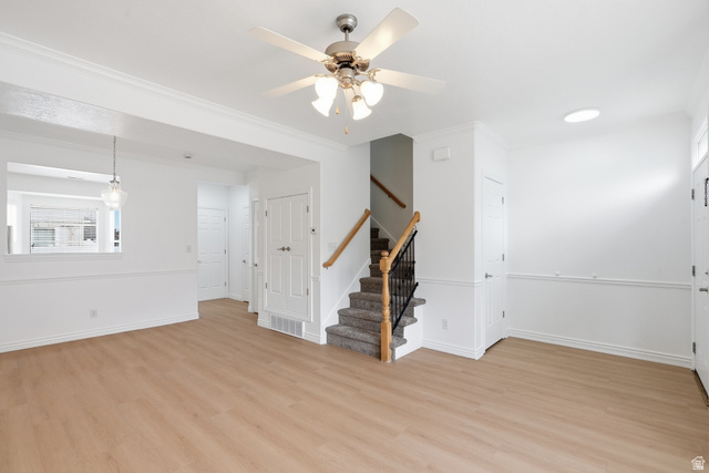 793 North 150 E Street Springville, UT 84663 - Photo 6 of 26 Open-concept living space with light wood-finish flooring, white walls, and crown molding