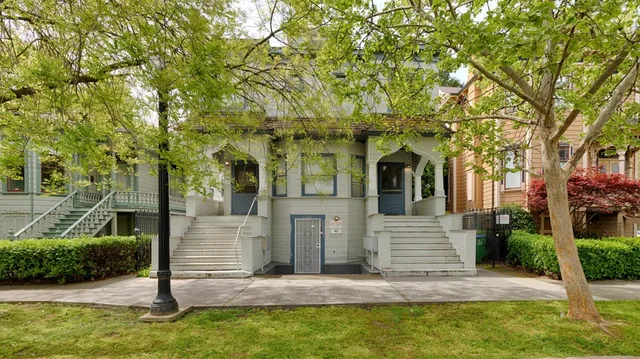 a front view of a house with garden