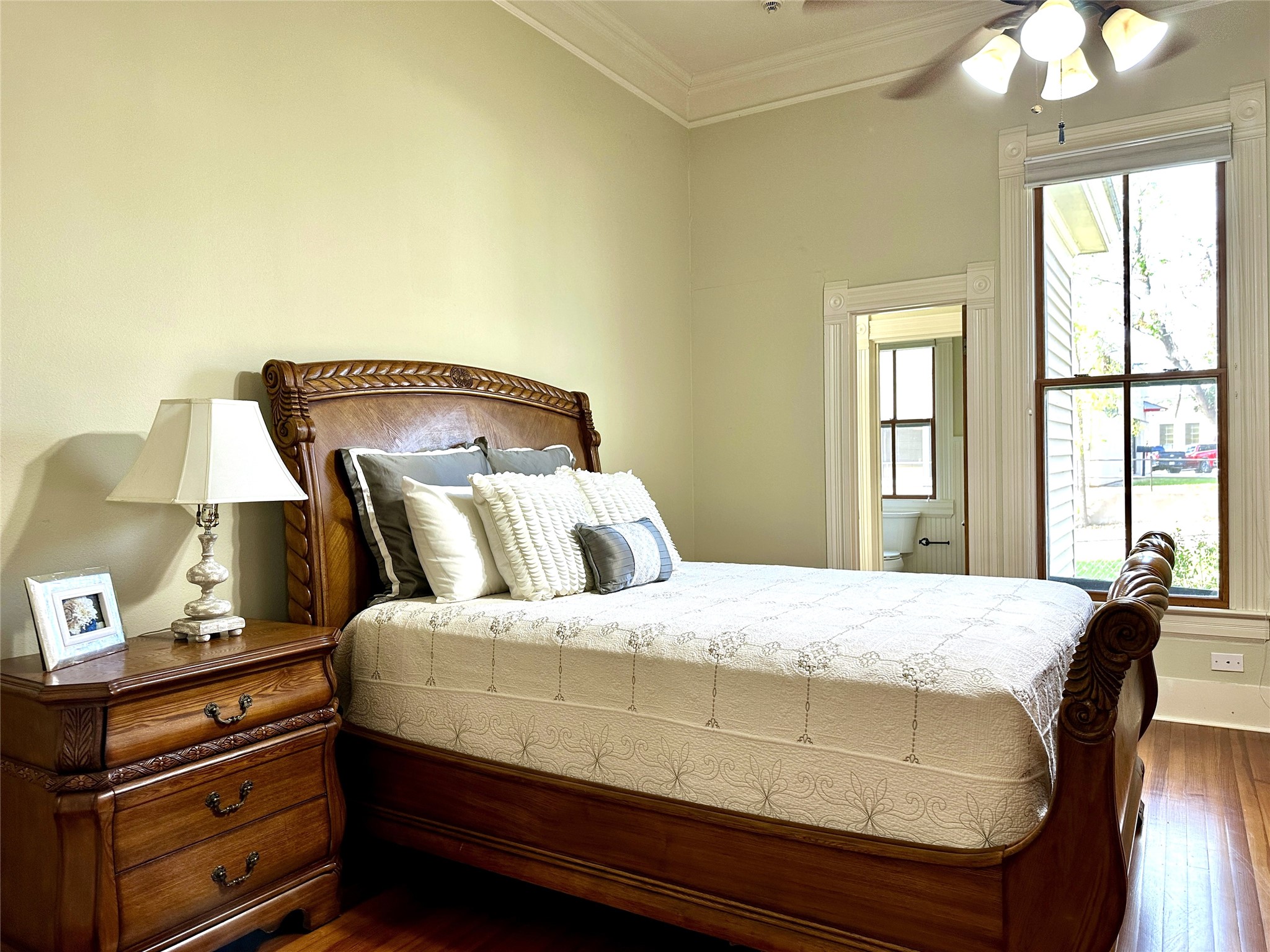 802 Main Street Bastrop, TX 78602 - Photo 11 of 37 a bedroom with a bed and wooden floor