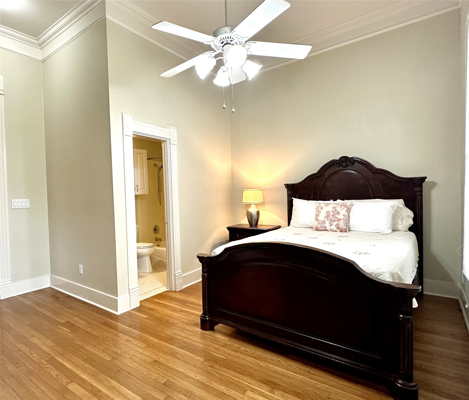 802 Main Street Bastrop, TX 78602 - Photo 13 of 37 a bedroom with a bed and a ceiling fan