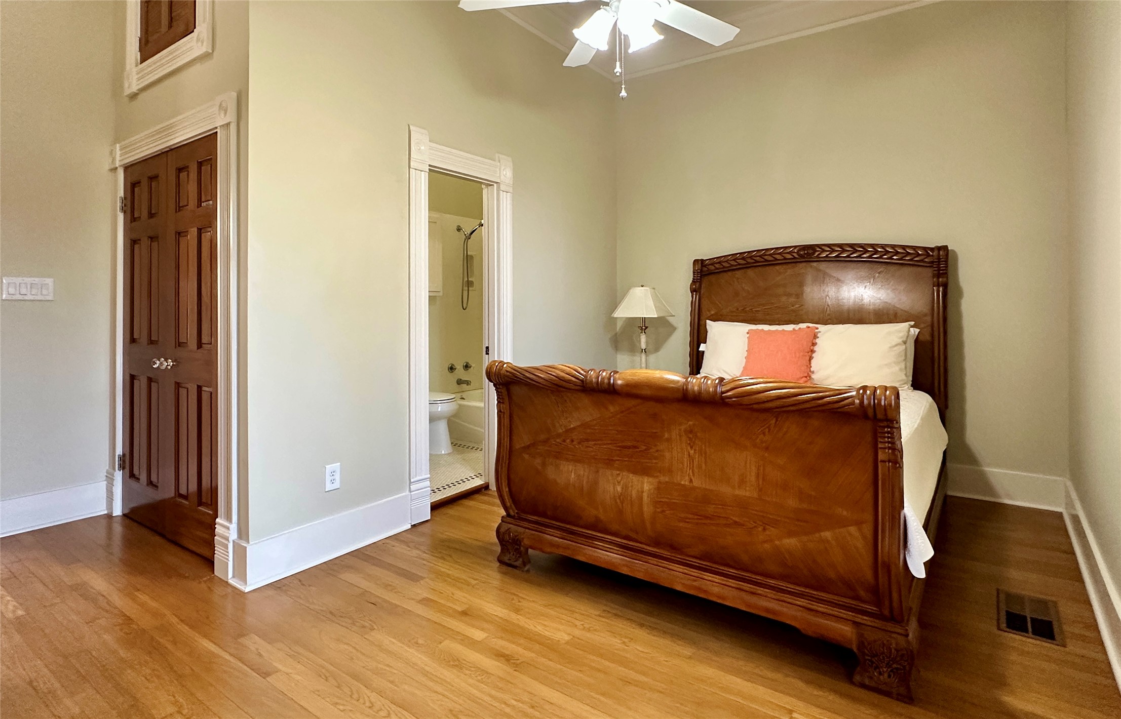 802 Main Street Bastrop, TX 78602 - Photo 15 of 37 a bedroom with a bed and a chandelier