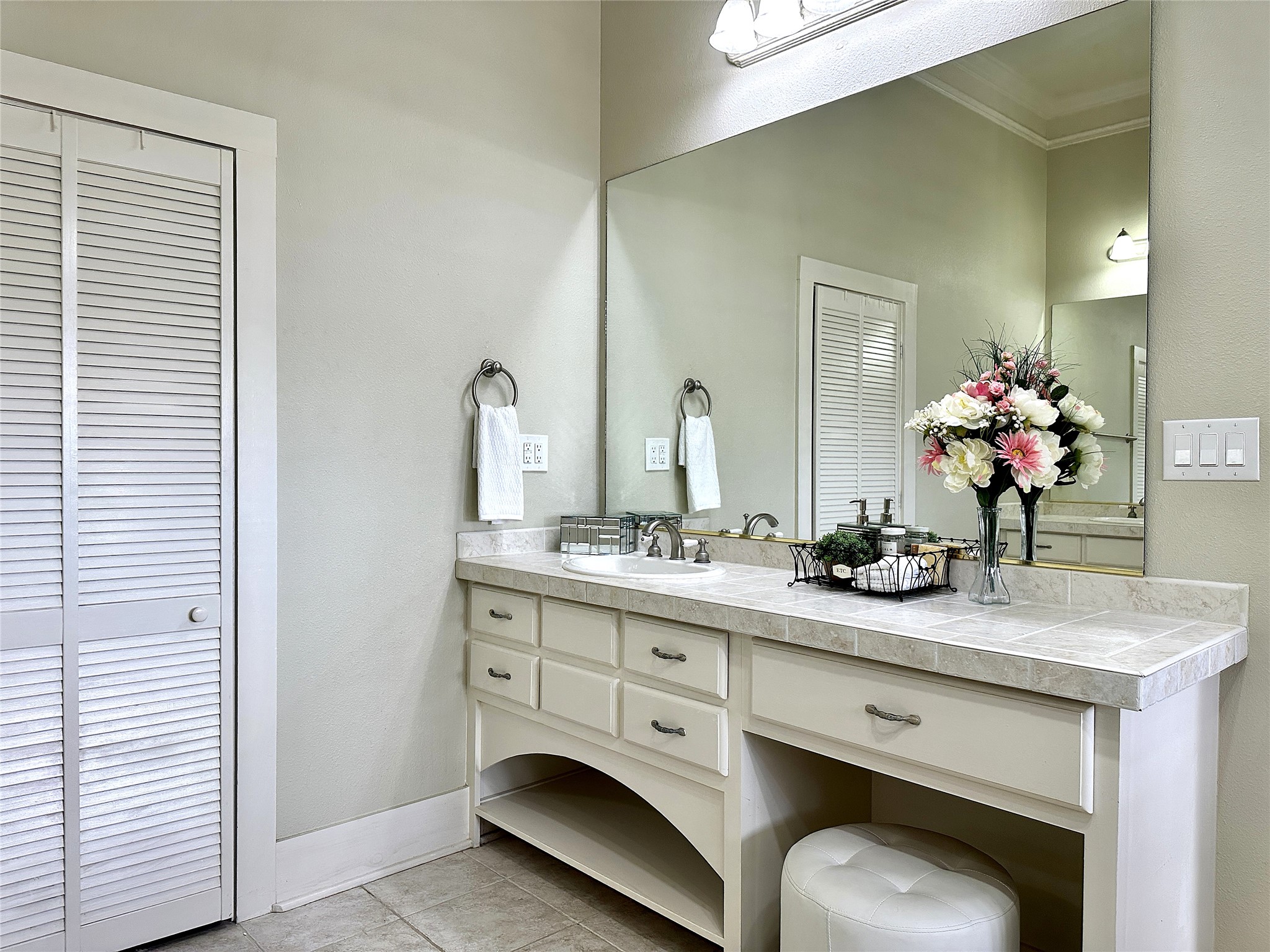 802 Main Street Bastrop, TX 78602 - Photo 24 of 37 a bathroom with a granite countertop sink a toilet and a mirror