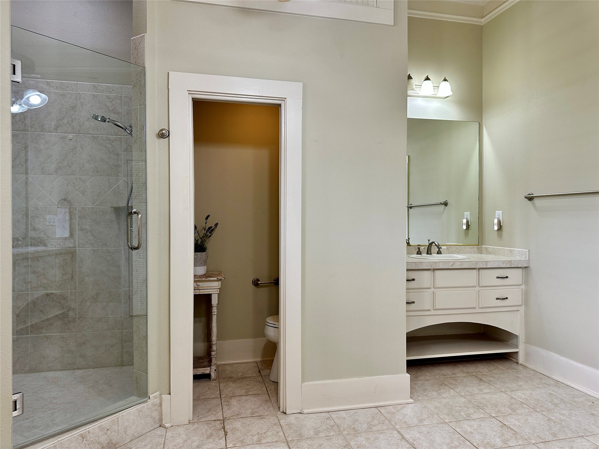 802 Main Street Bastrop, TX 78602 - Photo 26 of 37 a bathroom with a sink a toilet and shower