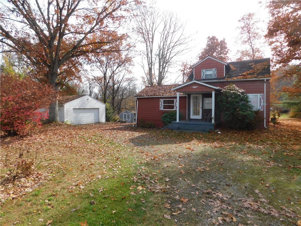 372 Airway Inn Road Uniontown, PA 15401 - Photo 1 of 9 a front view of a house with a yard and garage