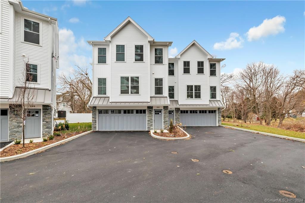 892 Oldfield Road Fairfield, CT 06824 - Photo 1 of 1 a view of a house with a yard and sitting area