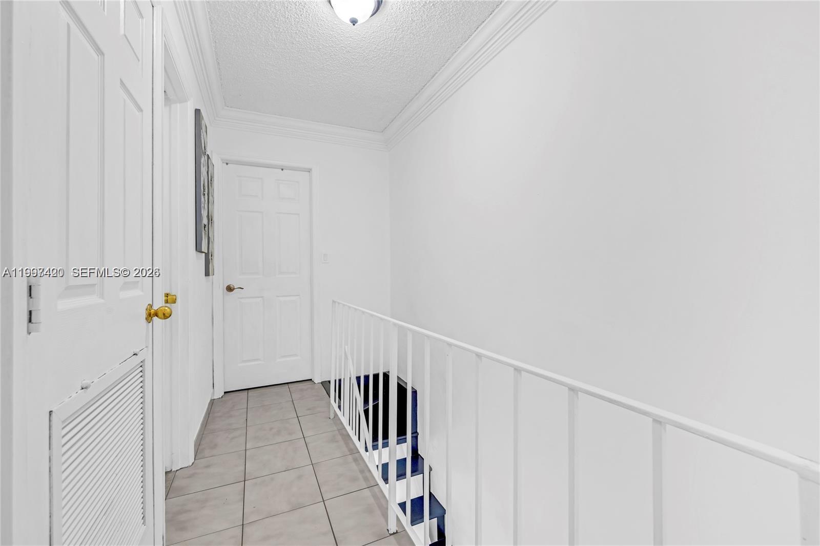 1675 West 57th Street, Unit 514 Hialeah, FL 33012 - Photo 11 of 26 a view of an entryway with staircase