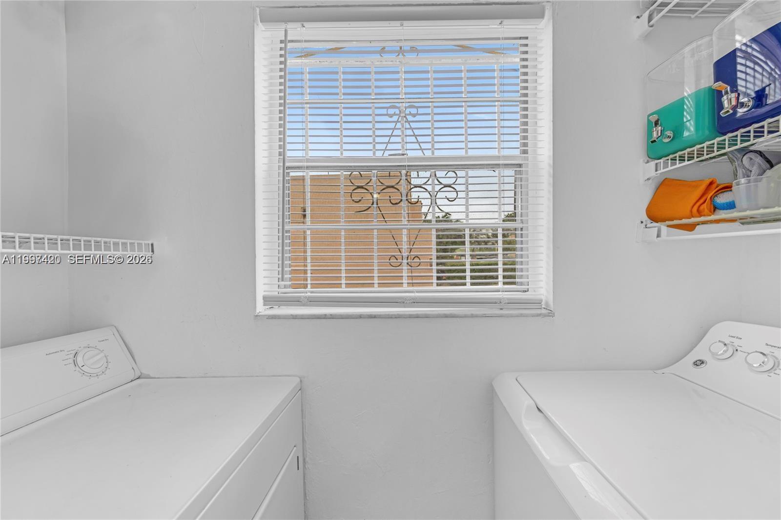 1675 West 57th Street, Unit 514 Hialeah, FL 33012 - Photo 16 of 26 a utility room with dryer and washer