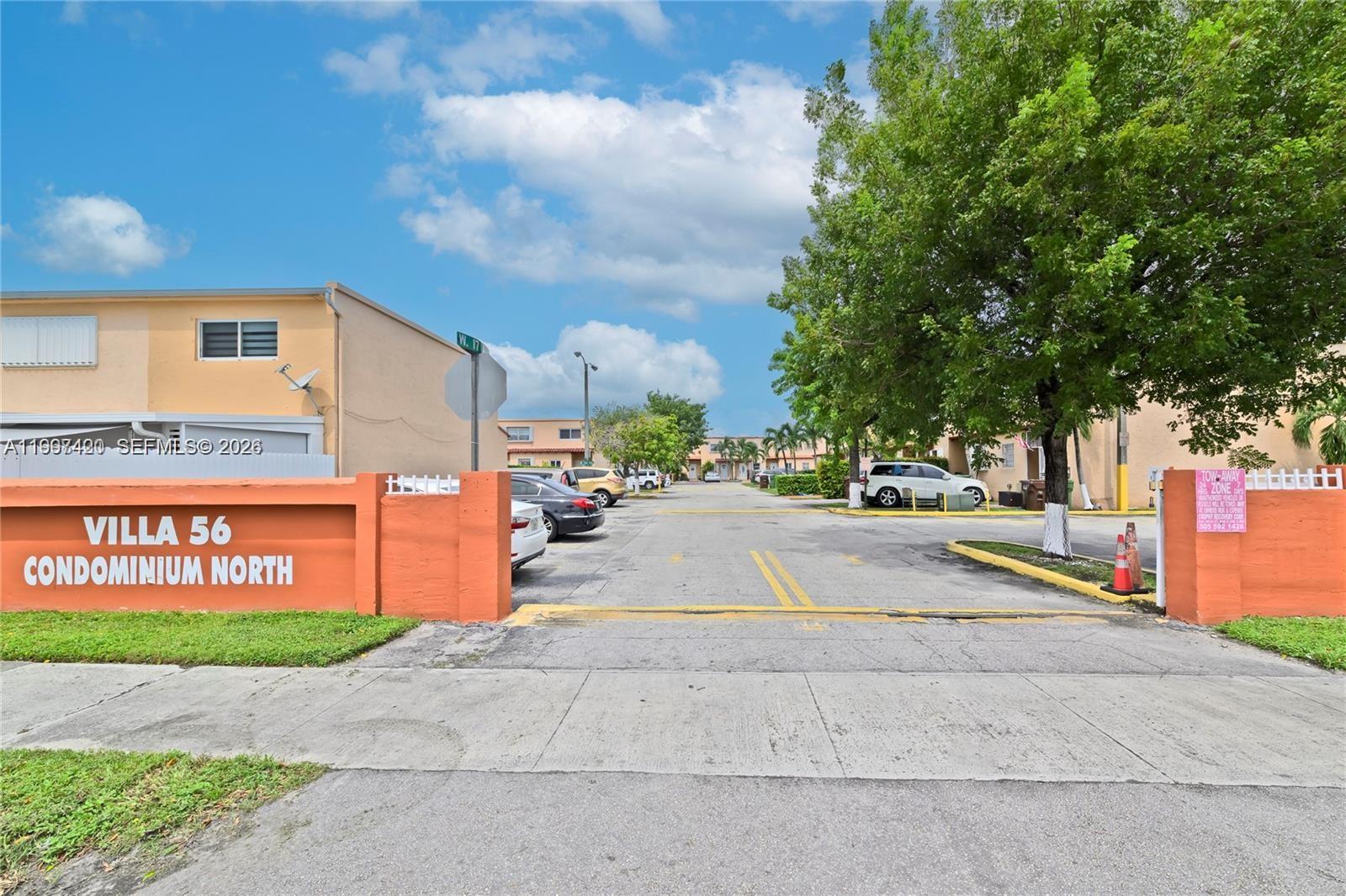 1675 West 57th Street, Unit 514 Hialeah, FL 33012 - Photo 26 of 26 a view of street with parked cars