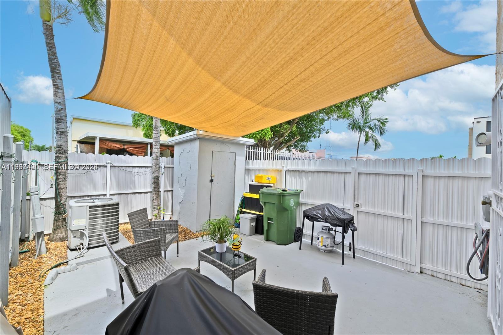 1675 West 57th Street, Unit 514 Hialeah, FL 33012 - Photo 7 of 26 a view of backyard with patio