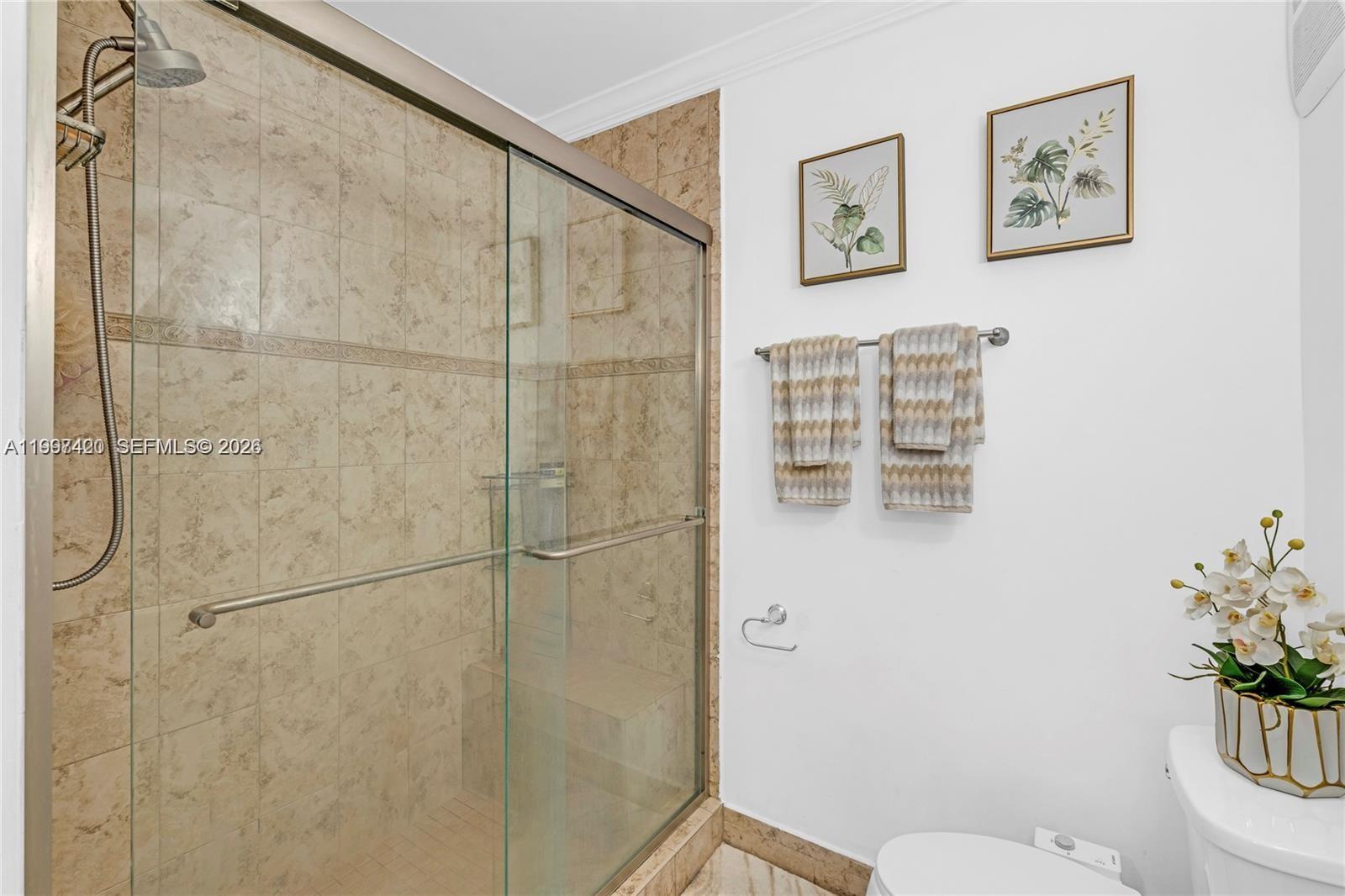 1675 West 57th Street, Unit 514 Hialeah, FL 33012 - Photo 10 of 26 a bathroom with a toilet and a shower