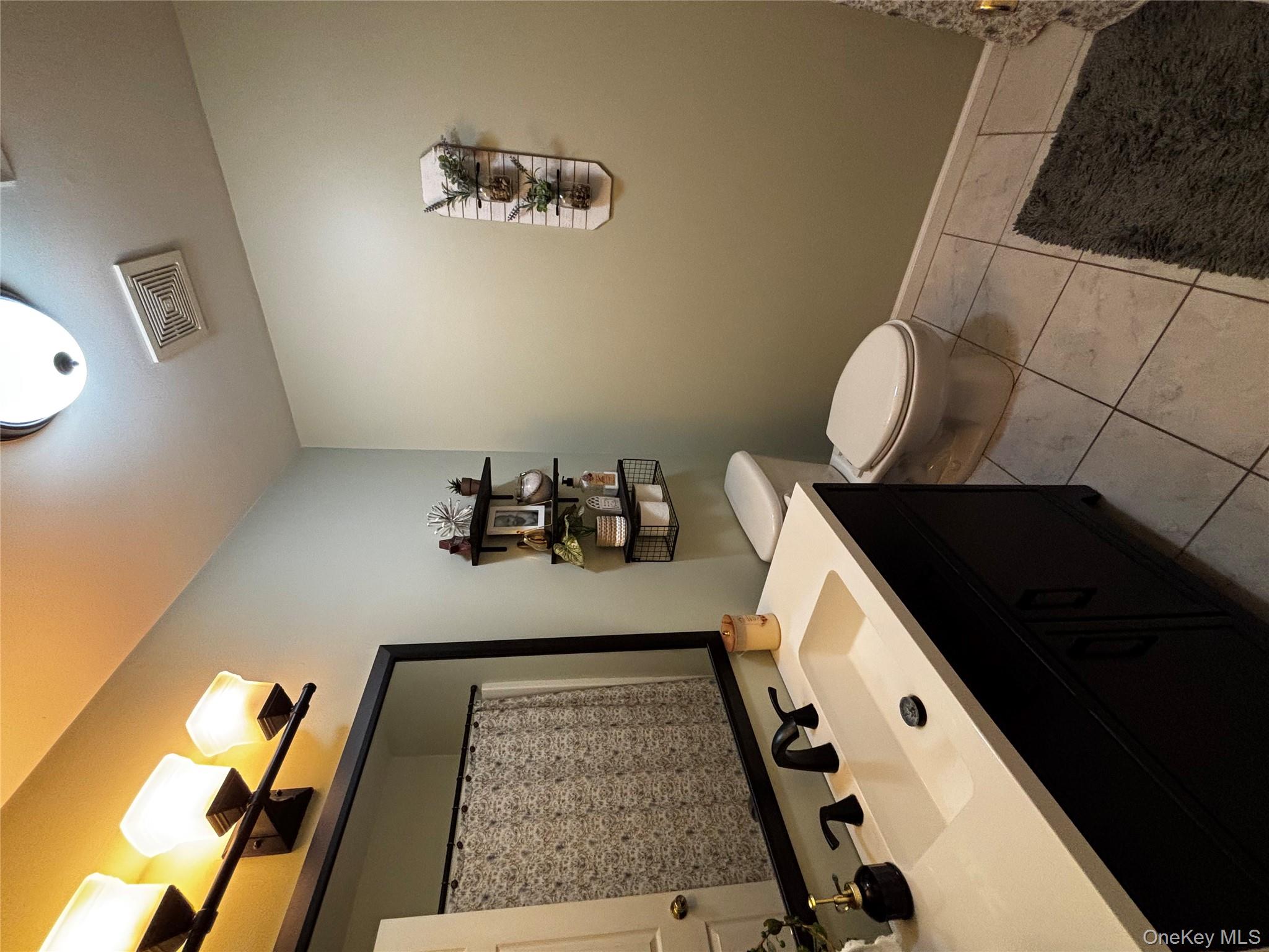 62 Triangle Of Clearwater Road Highland, NY 12528 - Photo 13 of 46 Bathroom featuring vanity, light tile patterned flooring, and a shower with curtain