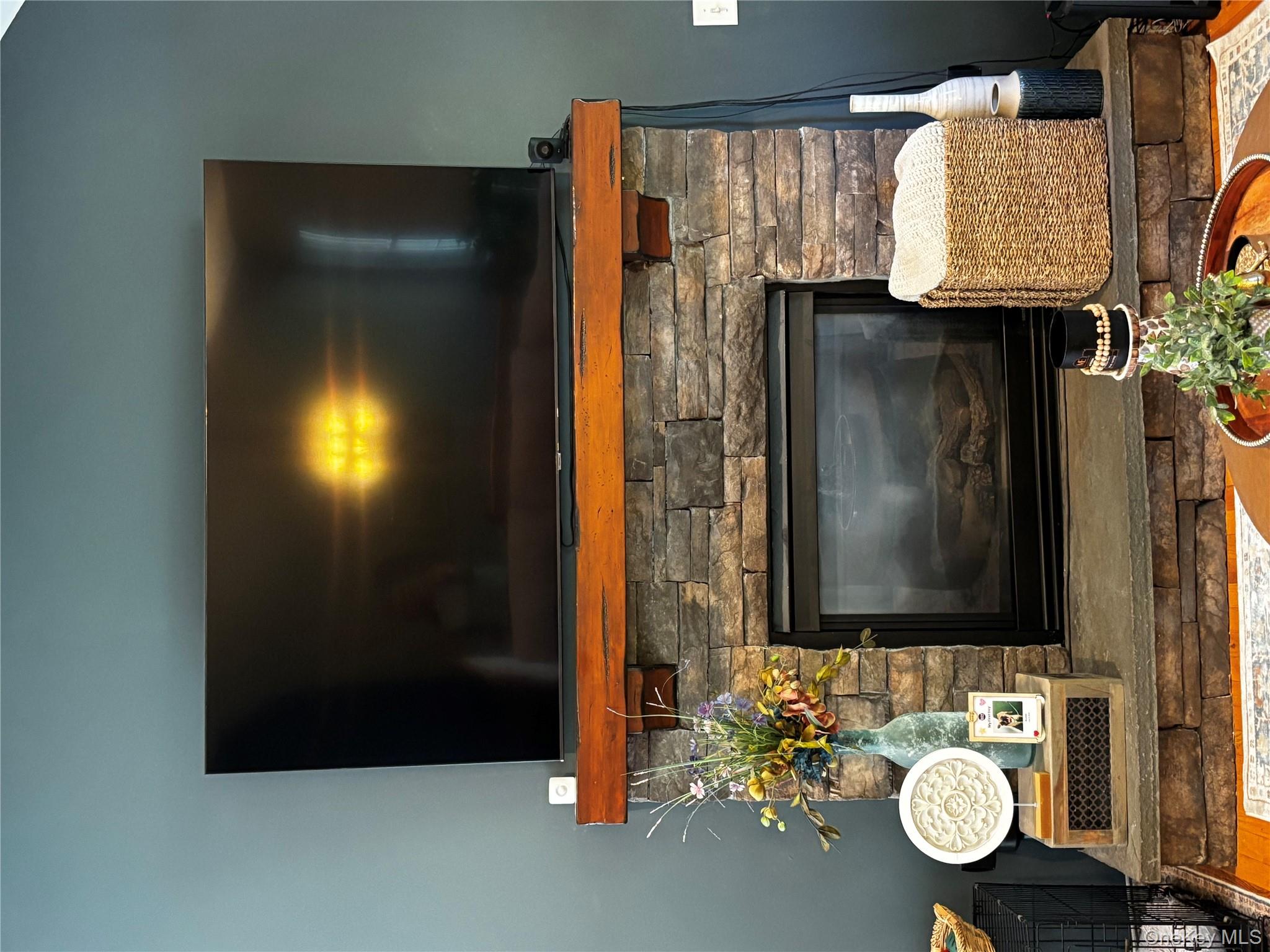 62 Triangle Of Clearwater Road Highland, NY 12528 - Photo 16 of 46 Detailed view of wood finished floors and a stone fireplace