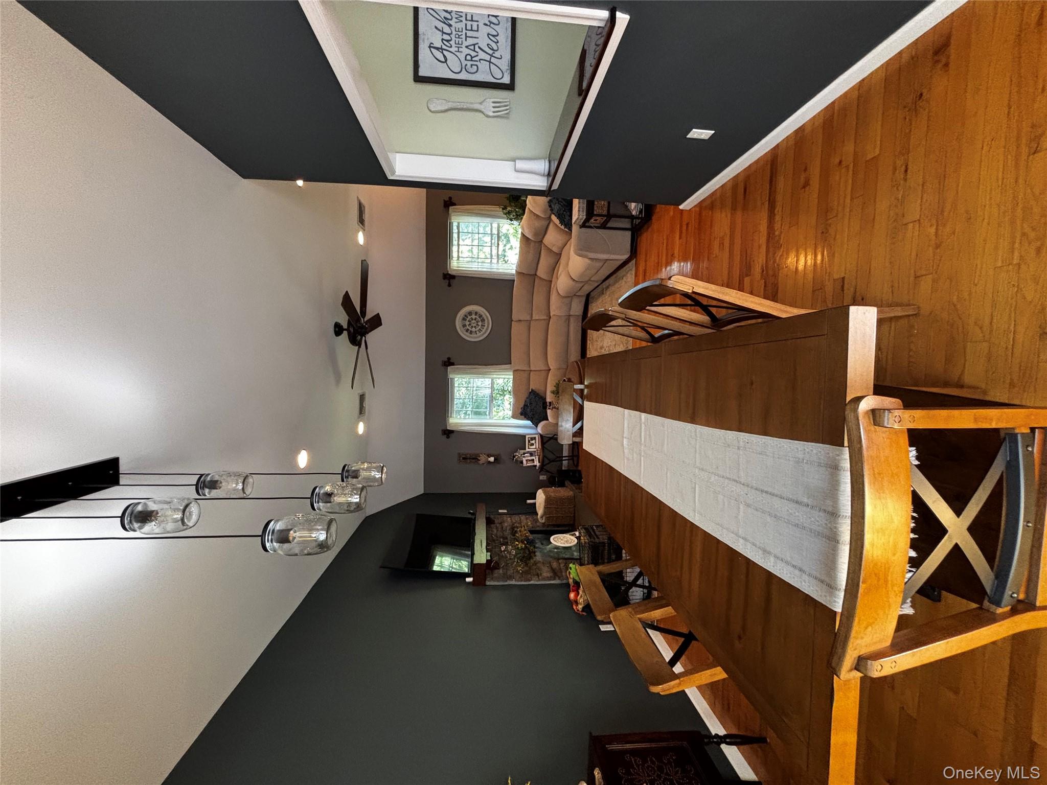62 Triangle Of Clearwater Road Highland, NY 12528 - Photo 20 of 46 Dining area featuring recessed lighting, a fireplace, wood finished floors, a ceiling fan, and vaulted ceiling