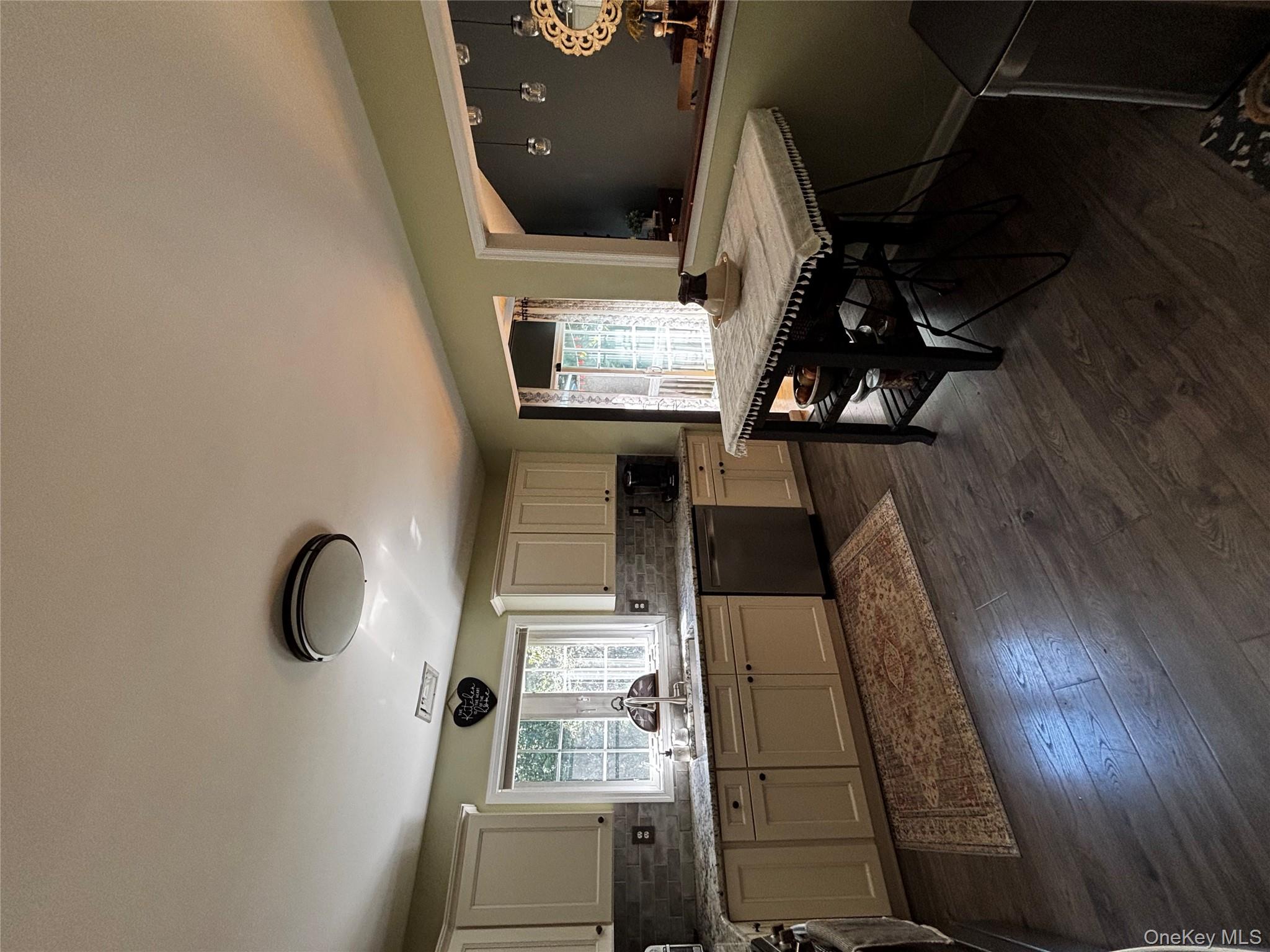 62 Triangle Of Clearwater Road Highland, NY 12528 - Photo 22 of 46 Kitchen with decorative backsplash, healthy amount of natural light, dark wood-type flooring, and dishwashing machine
