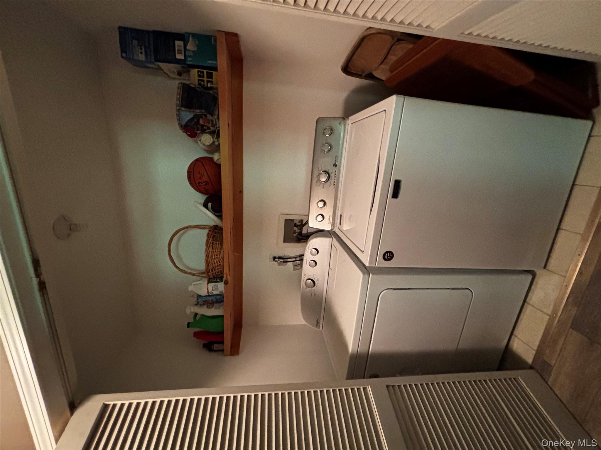 62 Triangle Of Clearwater Road Highland, NY 12528 - Photo 30 of 46 Washroom featuring separate washer and dryer, light tile patterned flooring, and a heating unit