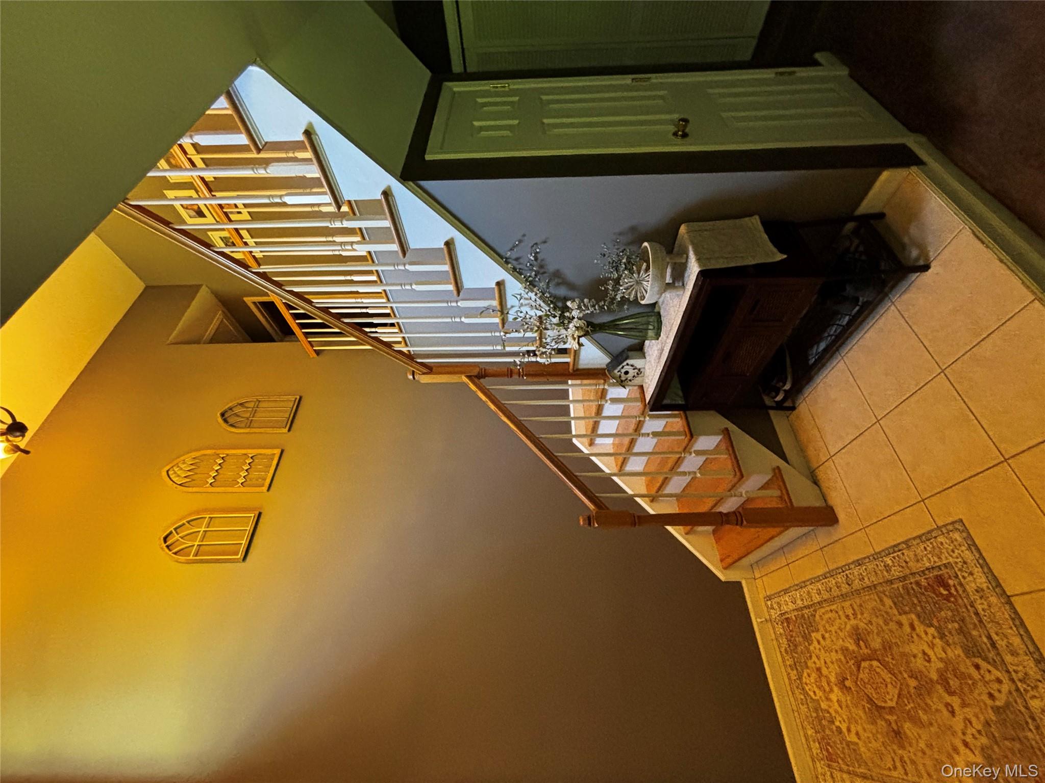 62 Triangle Of Clearwater Road Highland, NY 12528 - Photo 31 of 46 Staircase featuring tile patterned floors and baseboards