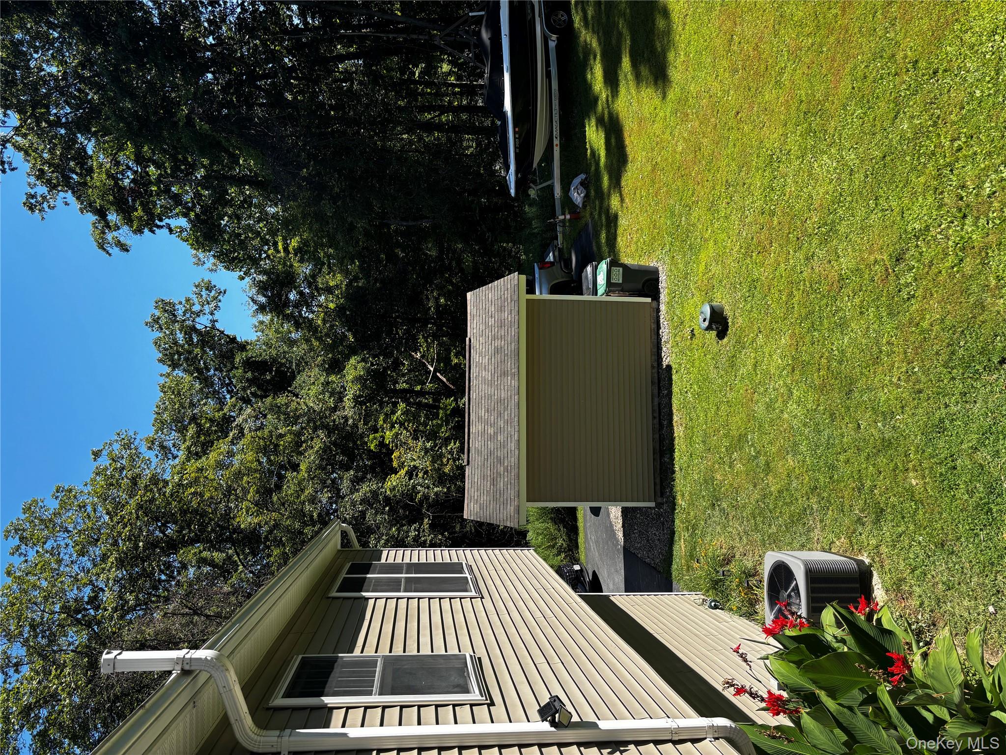 62 Triangle Of Clearwater Road Highland, NY 12528 - Photo 33 of 46 View of grassy yard with a storage shed and view of wooded area
