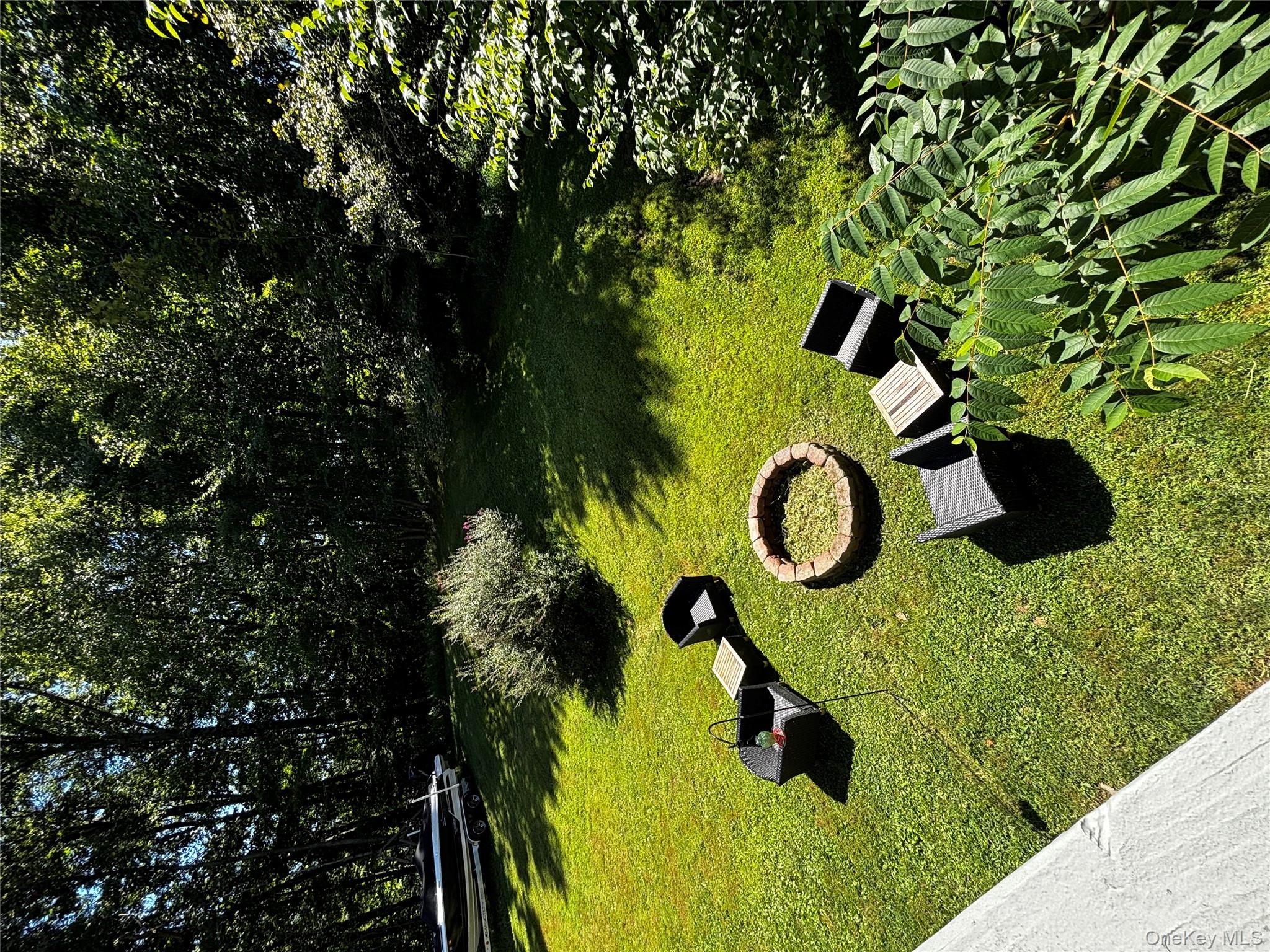 62 Triangle Of Clearwater Road Highland, NY 12528 - Photo 34 of 46 View of green lawn featuring an outdoor fire pit