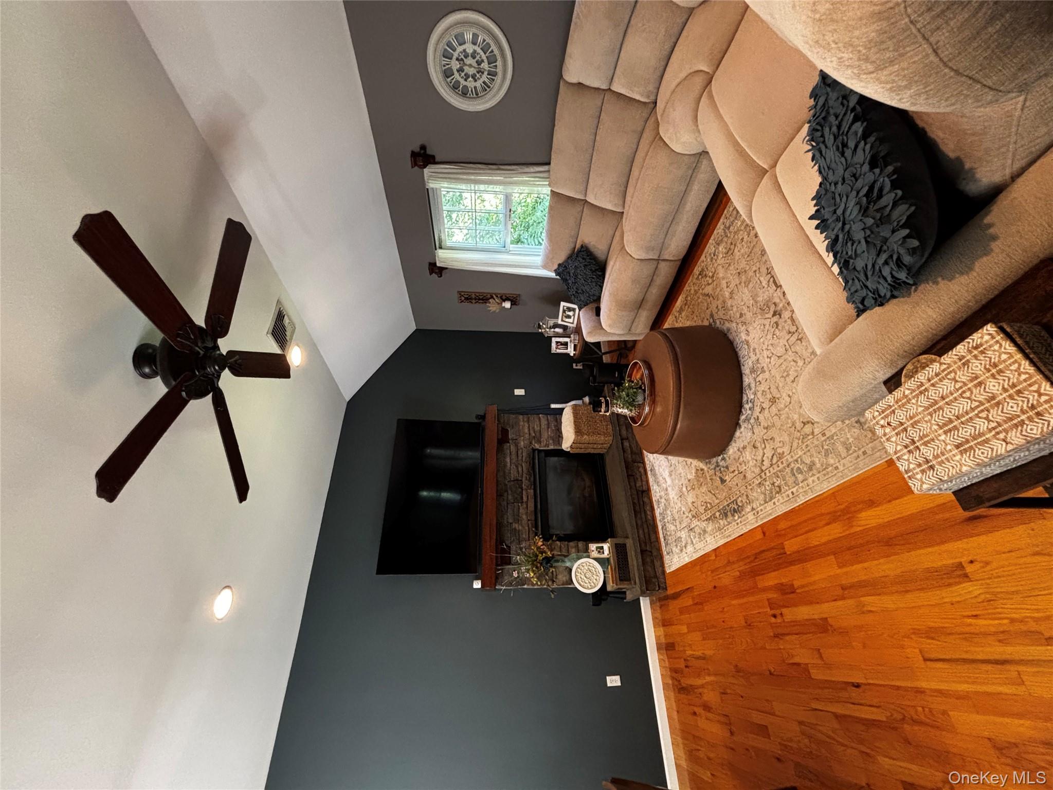 62 Triangle Of Clearwater Road Highland, NY 12528 - Photo 37 of 46 Living area with lofted ceiling, a fireplace, wood finished floors, ceiling fan, and recessed lighting