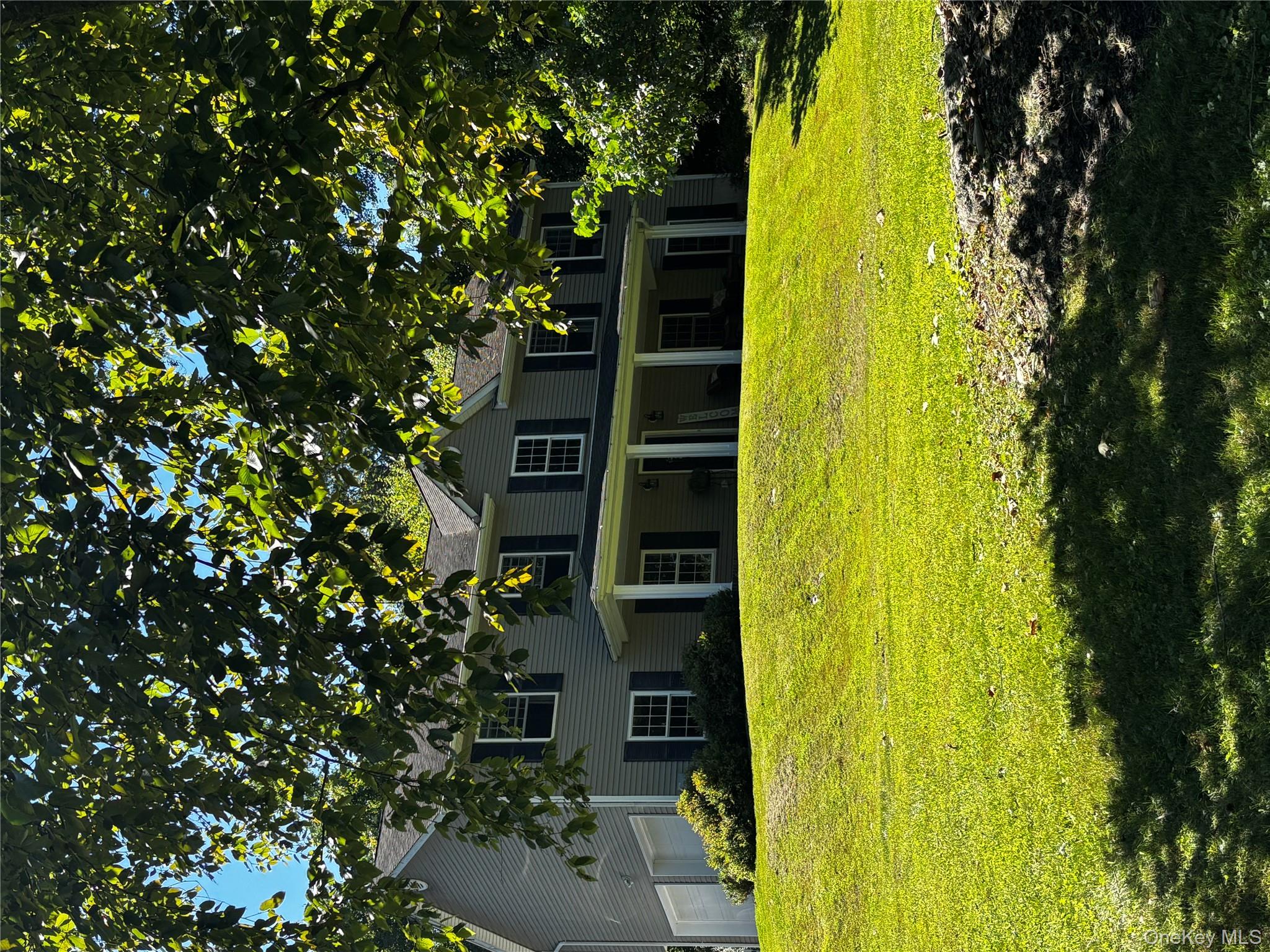 62 Triangle Of Clearwater Road Highland, NY 12528 - Photo 44 of 46 Colonial house featuring a garage and a front lawn