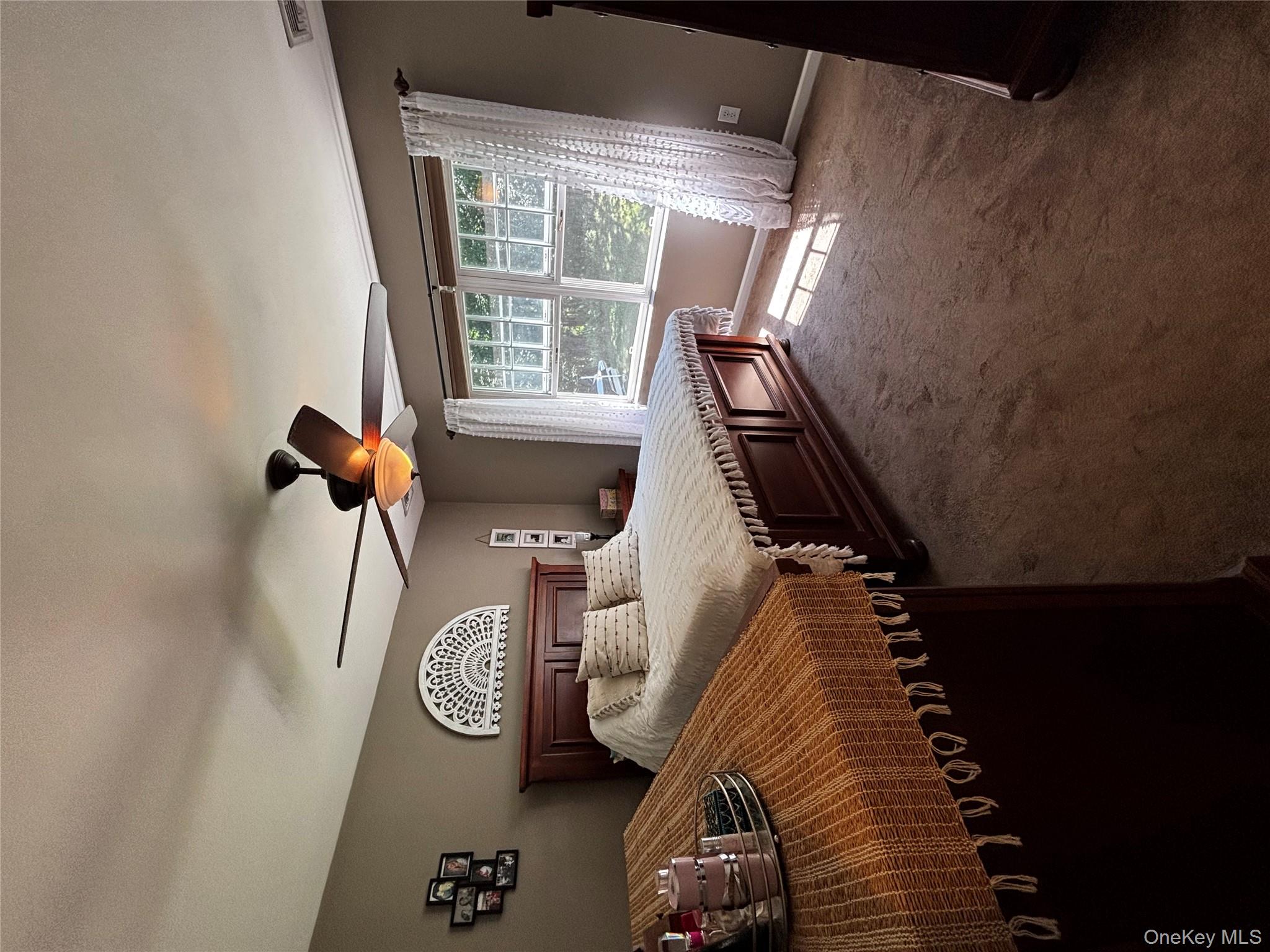 62 Triangle Of Clearwater Road Highland, NY 12528 - Photo 8 of 46 Carpeted bedroom featuring a ceiling fan and baseboards