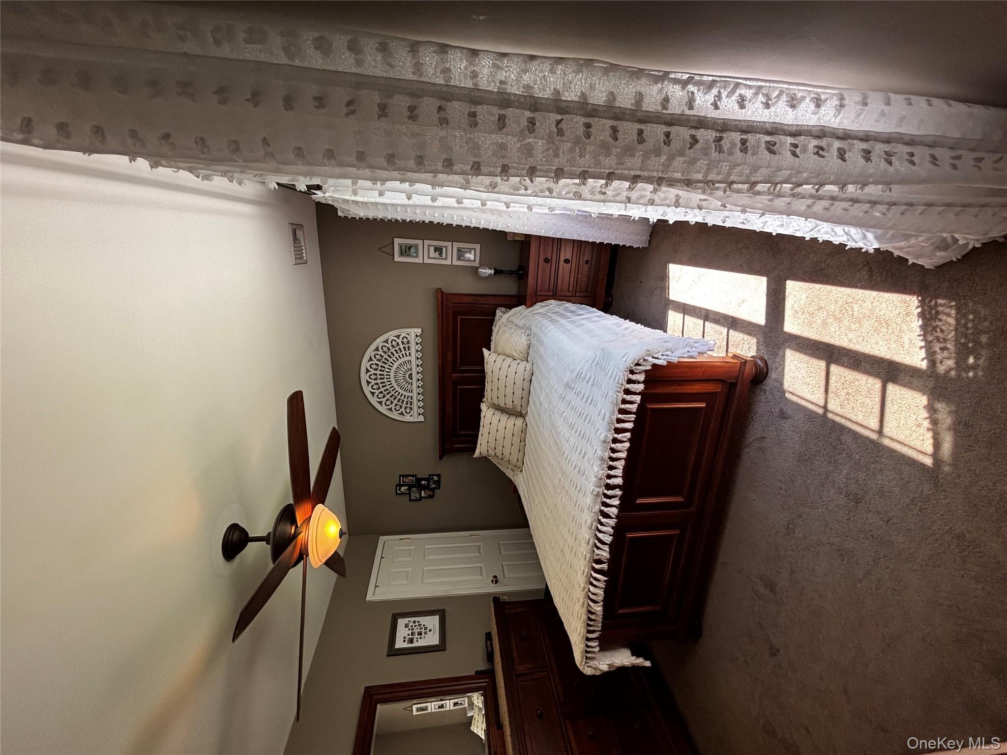 62 Triangle Of Clearwater Road Highland, NY 12528 - Photo 9 of 46 Bedroom featuring carpet and a ceiling fan