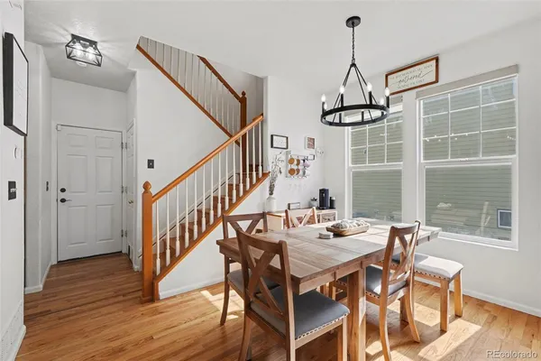 a view of a dining room with furniture window and wooden floor