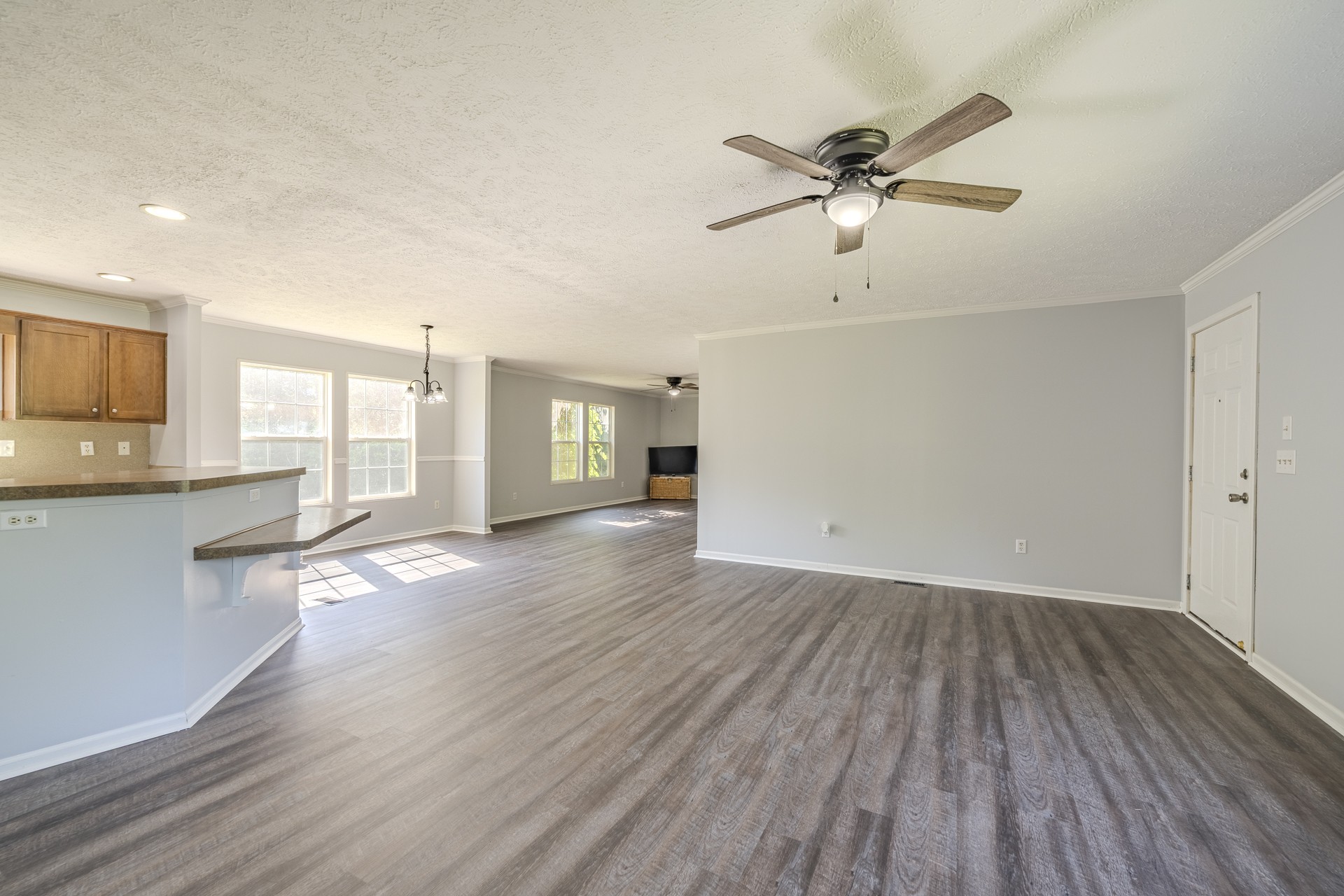 1125 Clifft Road Bolivar, TN 38008 - Photo 9 of 78 a view of empty room with wooden floor and fan