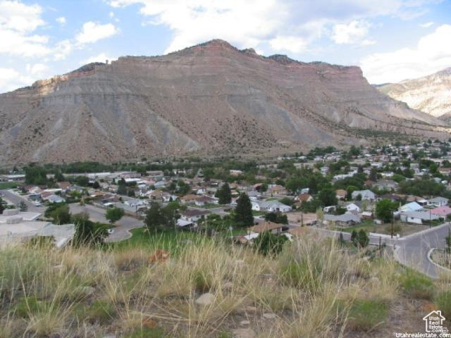 700 Spring Canyon Road Helper, UT 84526 - Photo 15 of 19 Expansive desert mountain backdrop with a residential area below
