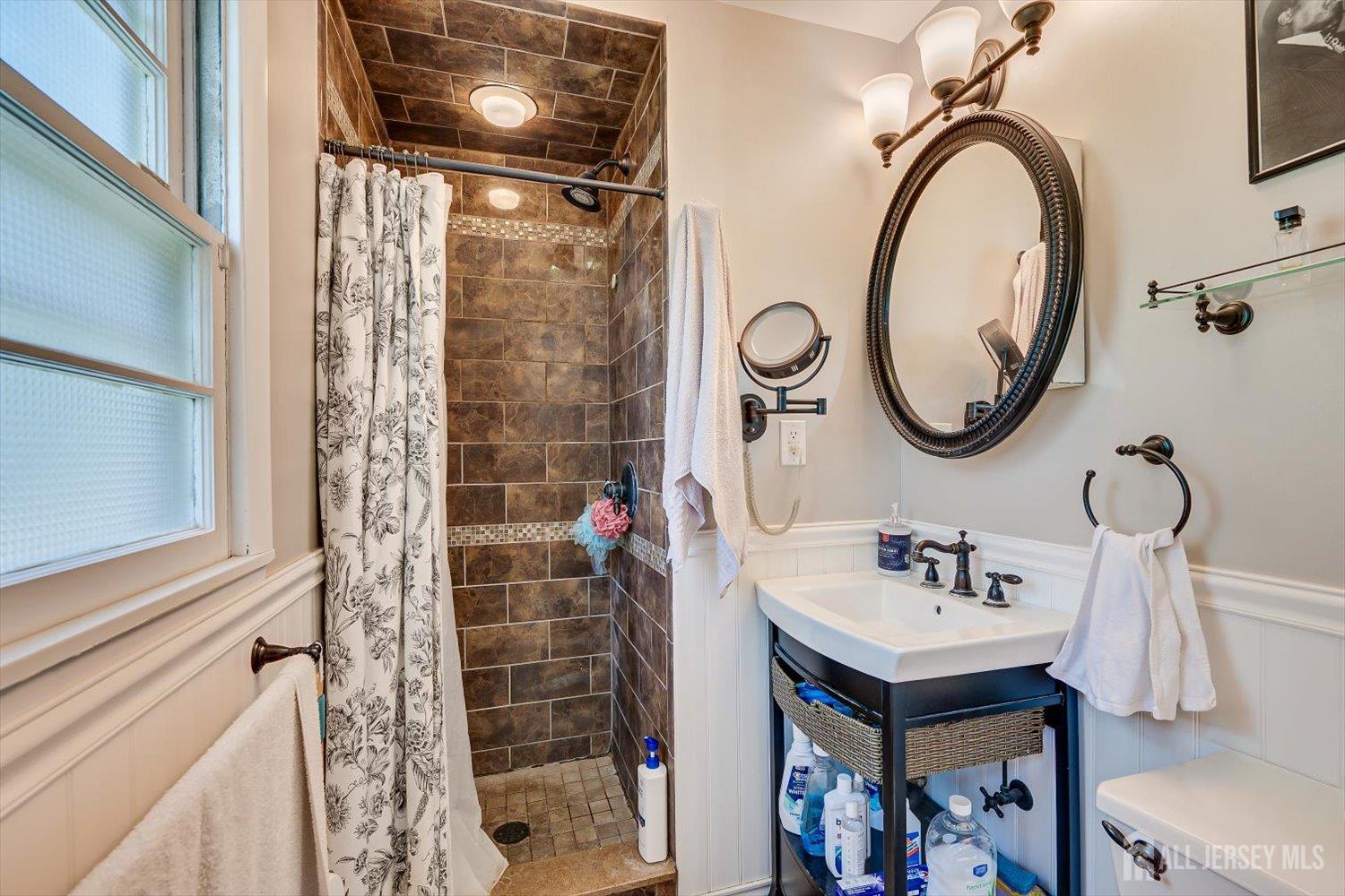 12 Gales Road Edison, NJ 08837 - Photo 19 of 35 a bathroom with a sink and a mirror