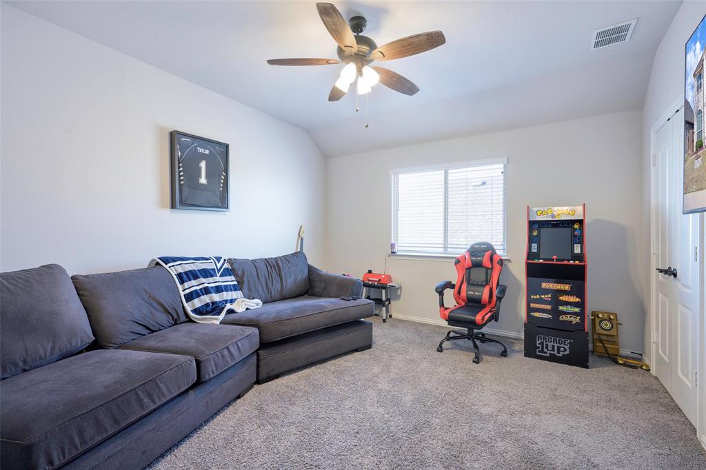 4059 Three Forks Road Kaufman, TX 75142 - Photo 19 of 25 a living room with furniture and a gym machine