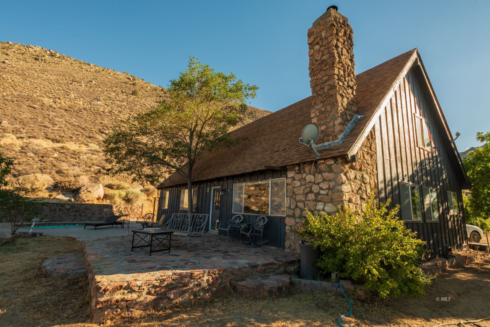 57 Bir Road Bishop, CA 93514 - Photo 1 of 35 a view of a house with backyard and sitting area