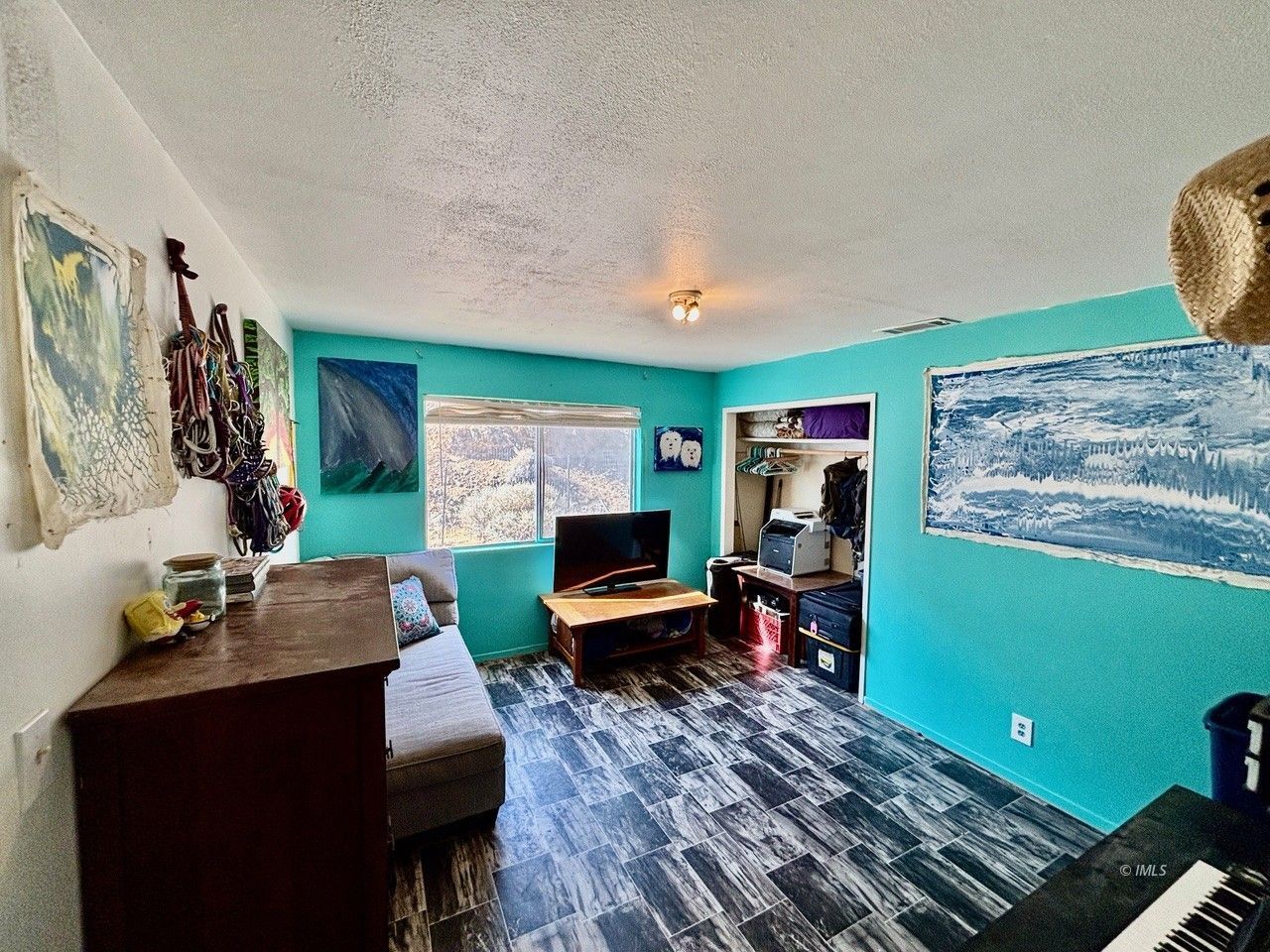 57 Bir Road Bishop, CA 93514 - Photo 16 of 35 a living room with furniture and a flat screen tv
