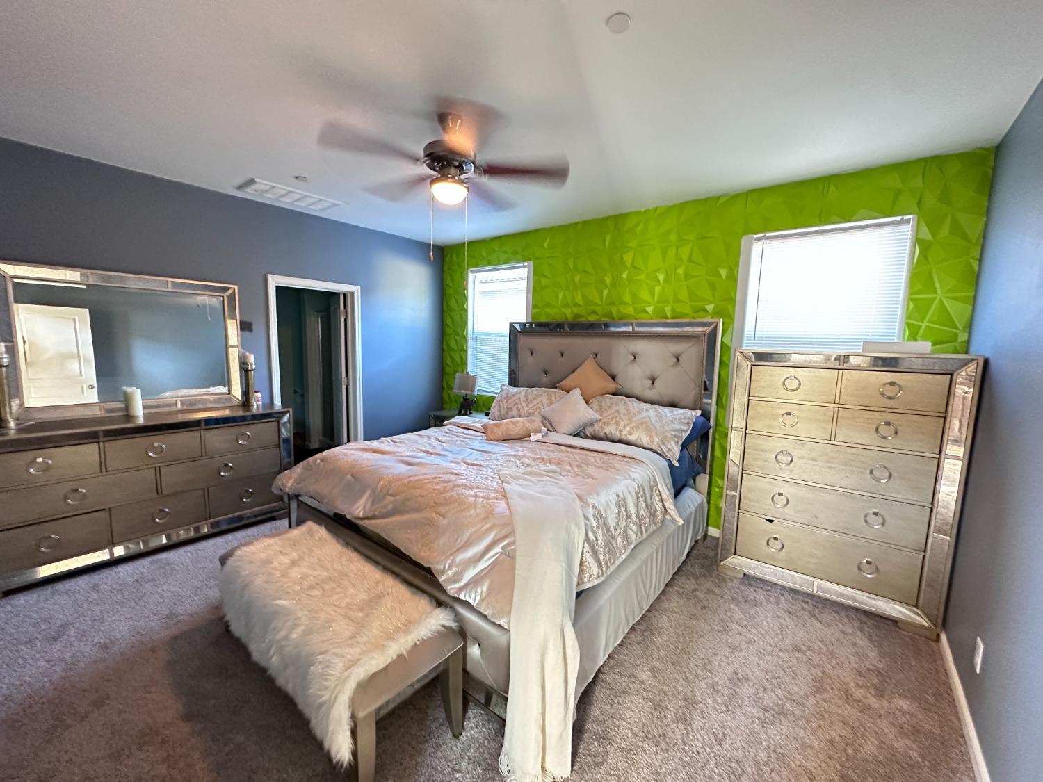 1263 Padre Street Madera, CA 93638 - Photo 11 of 26 a bedroom with a bed and a dresser