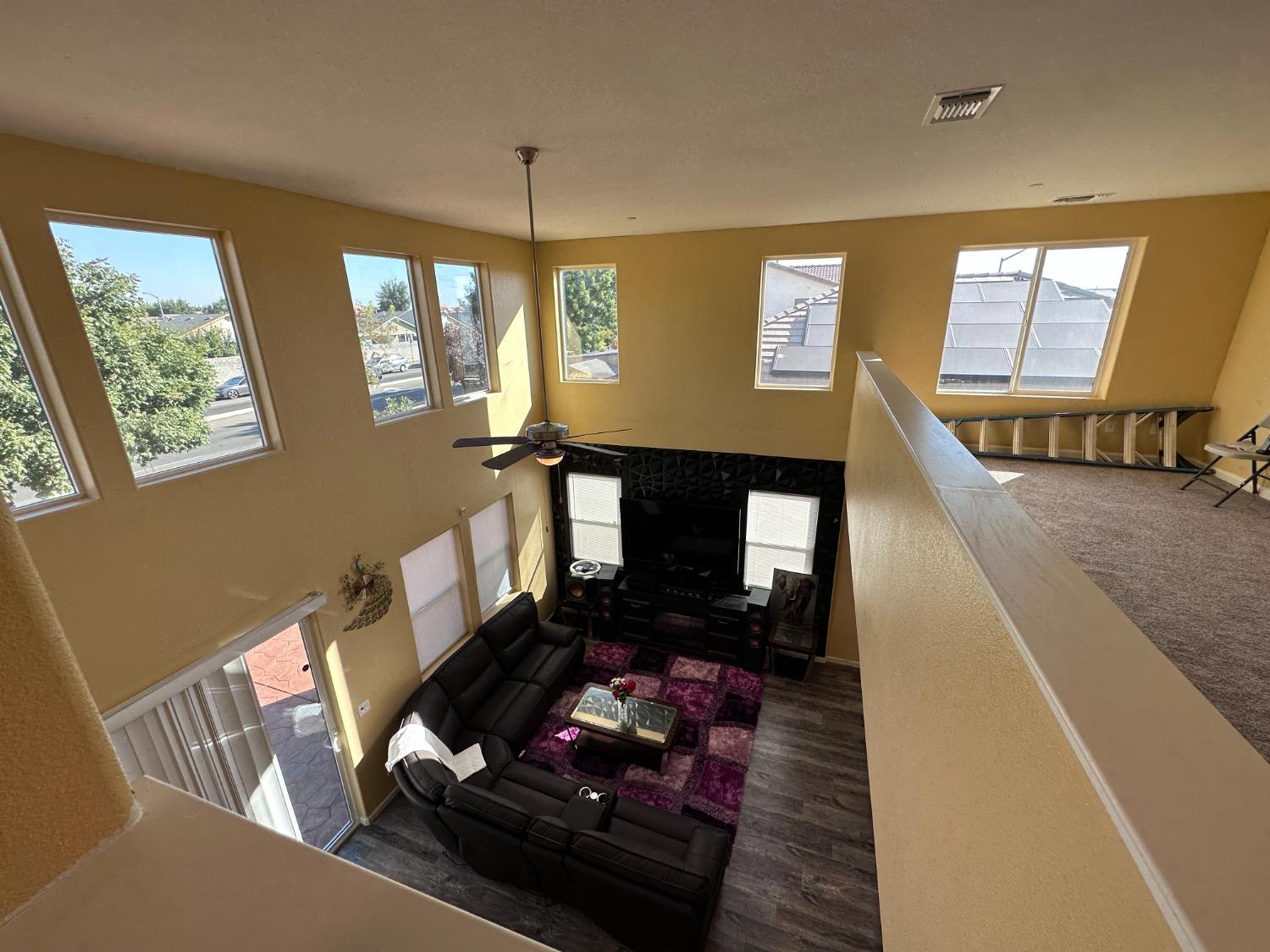 1263 Padre Street Madera, CA 93638 - Photo 19 of 26 a living room with furniture and a fireplace