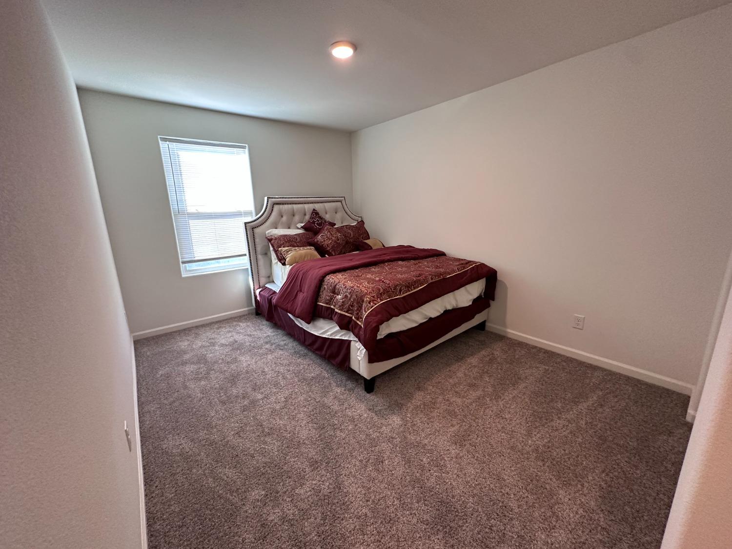 1263 Padre Street Madera, CA 93638 - Photo 25 of 26 a room with a bed and window