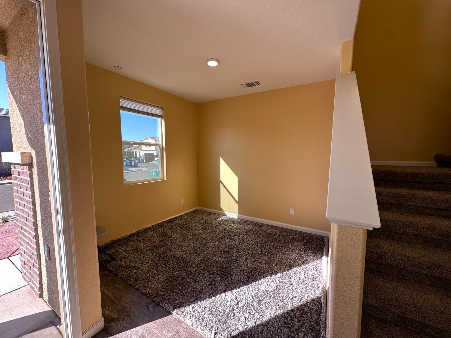 1263 Padre Street Madera, CA 93638 - Photo 3 of 26 a view of an empty room and window