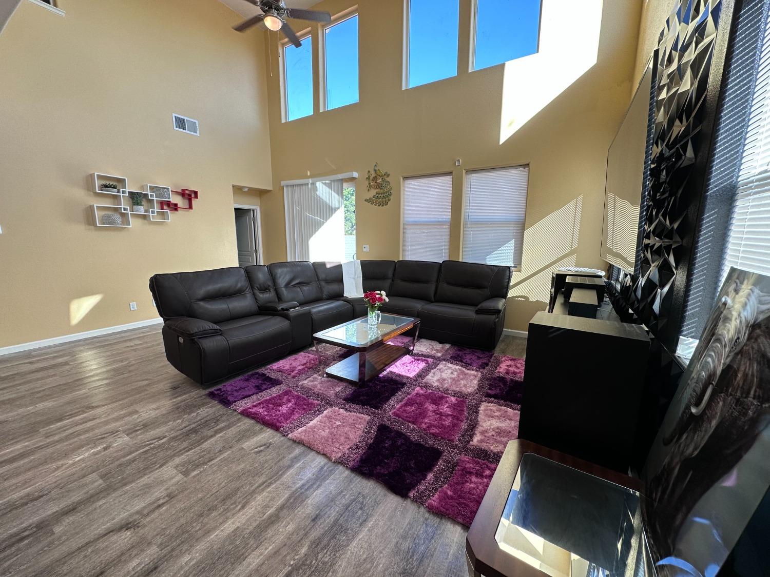 1263 Padre Street Madera, CA 93638 - Photo 8 of 26 a living room with furniture and wooden floor
