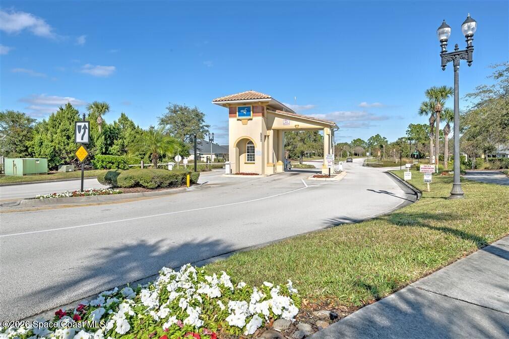 6904 Renshaw Drive Melbourne, FL 32940 - Photo 36 of 46 a front view of a house with a yard