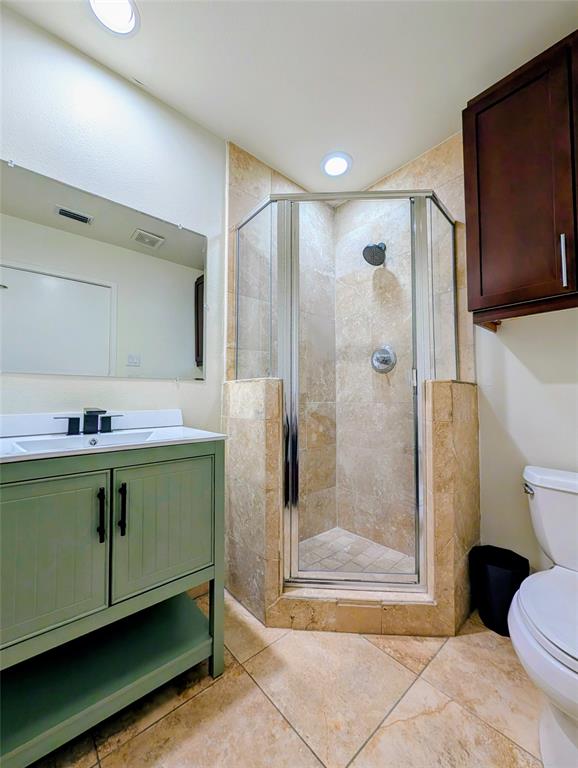 1016 Liberty Street, Unit 2 Dallas, TX 75204 - Photo 16 of 24 a bathroom with a shower sink and toilet