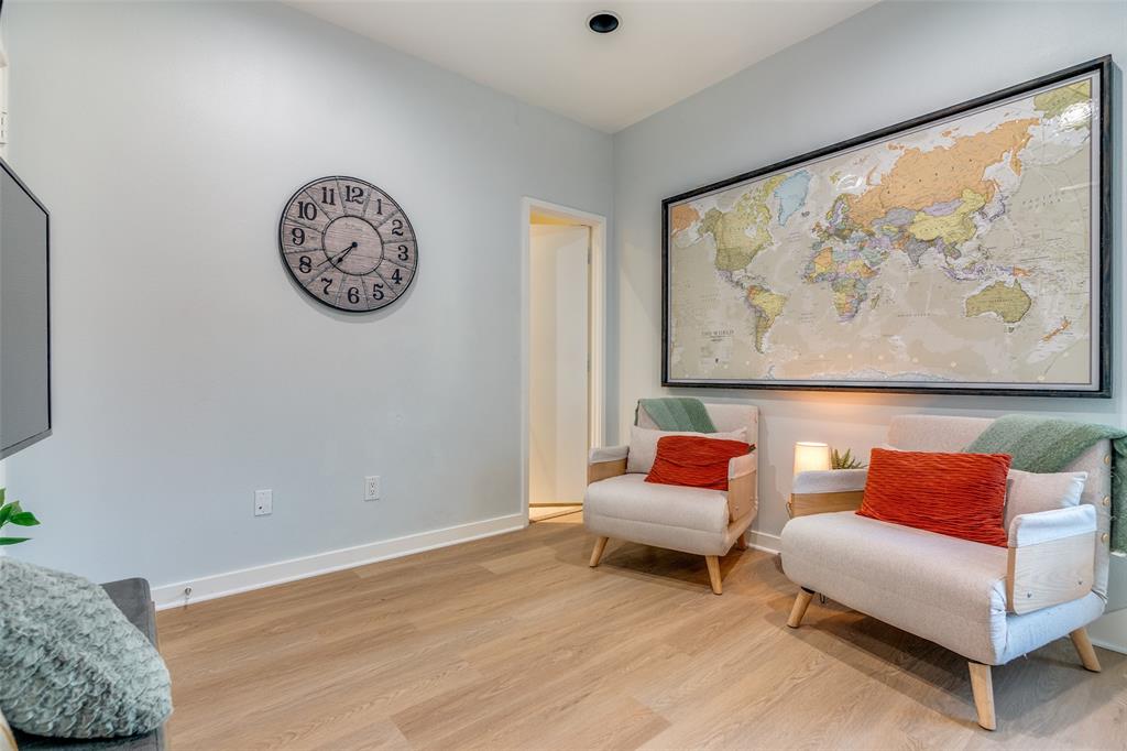 1016 Liberty Street, Unit 2 Dallas, TX 75204 - Photo 17 of 24 a living room with furniture and a painting on the wall