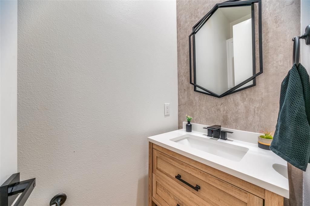 1016 Liberty Street, Unit 2 Dallas, TX 75204 - Photo 10 of 24 a bathroom with a sink and a mirror