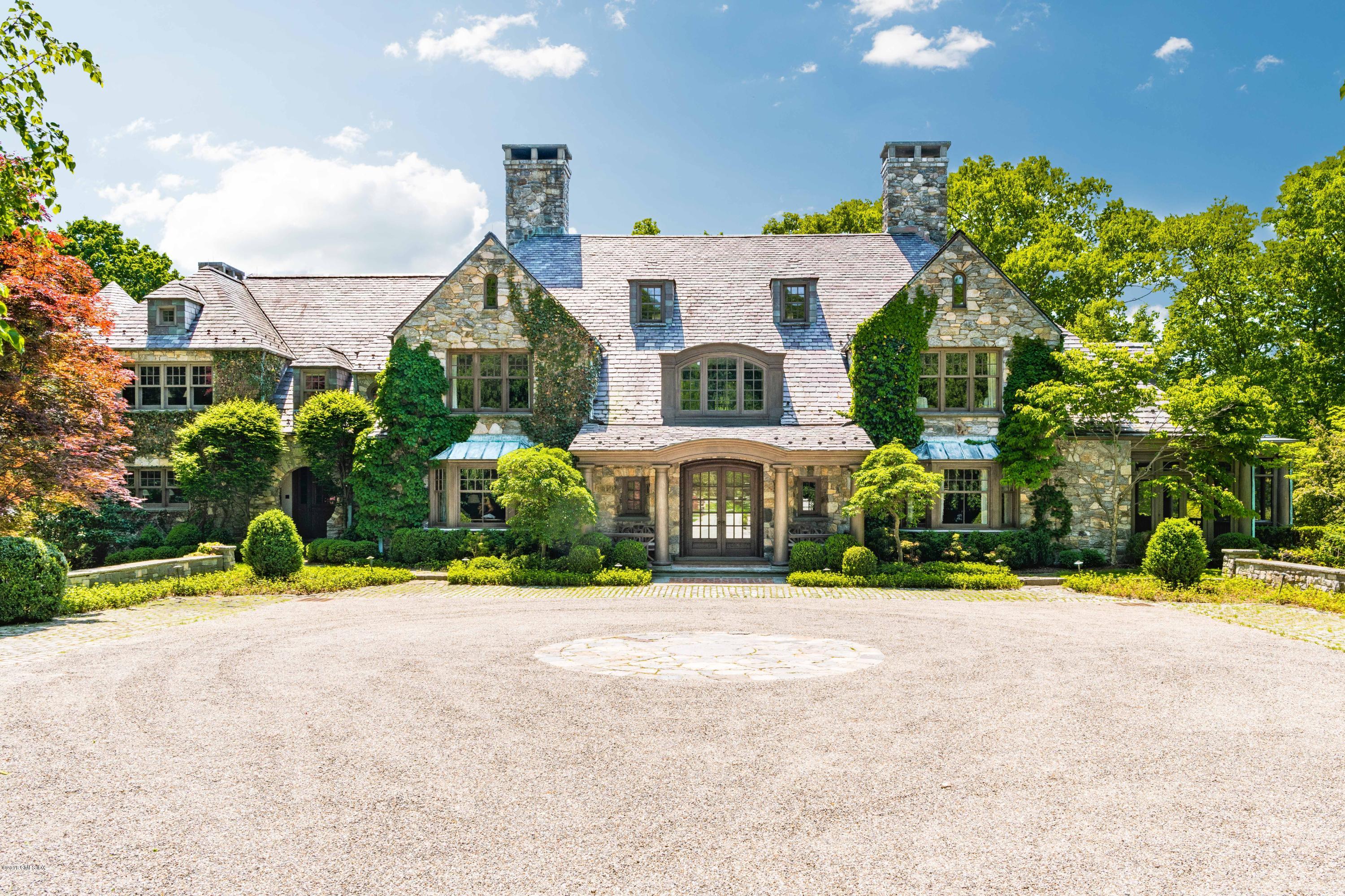 22 Hurlingham Drive Greenwich, CT 06831 - Photo 1 of 1 a front view of house with yard and green space