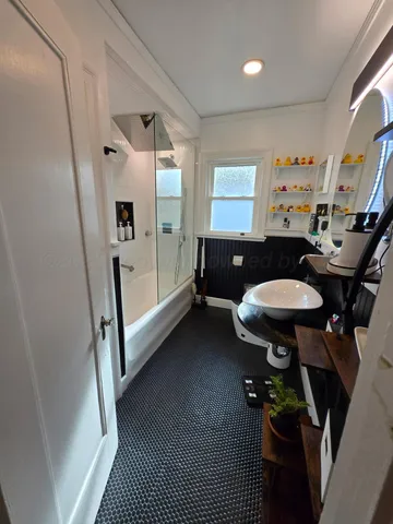 a room with furniture and a mirror