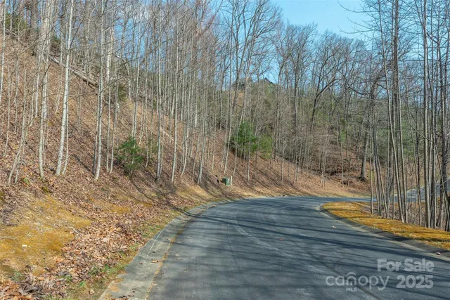 a view of a room with wooden floor and bench