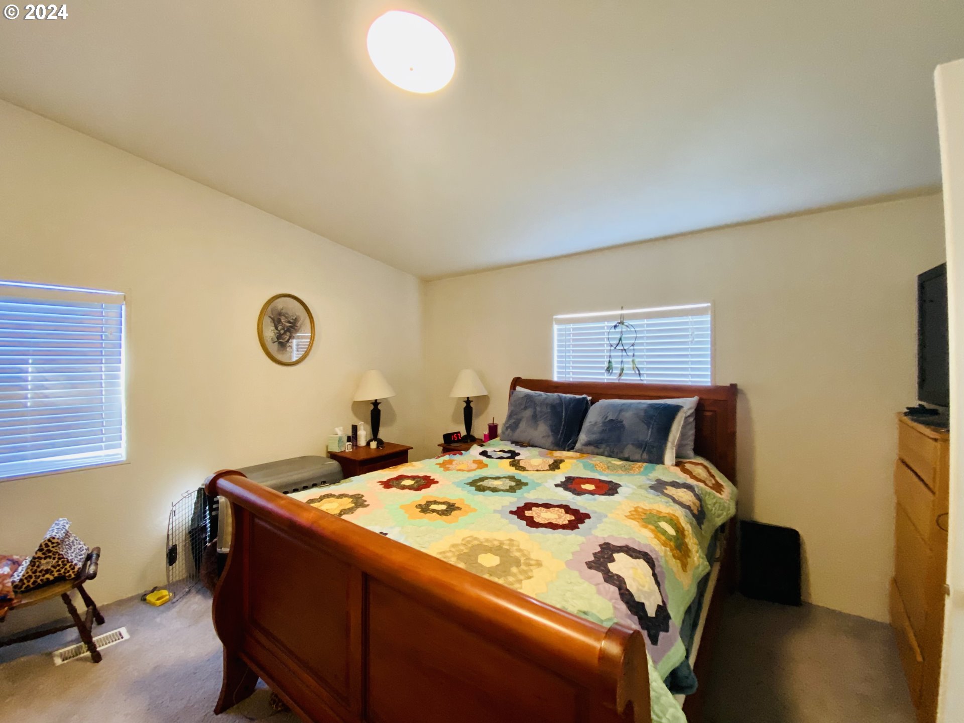 657 54th Street Springfield, OR 97478 - Photo 15 of 28 a bed room with a bed and a chair