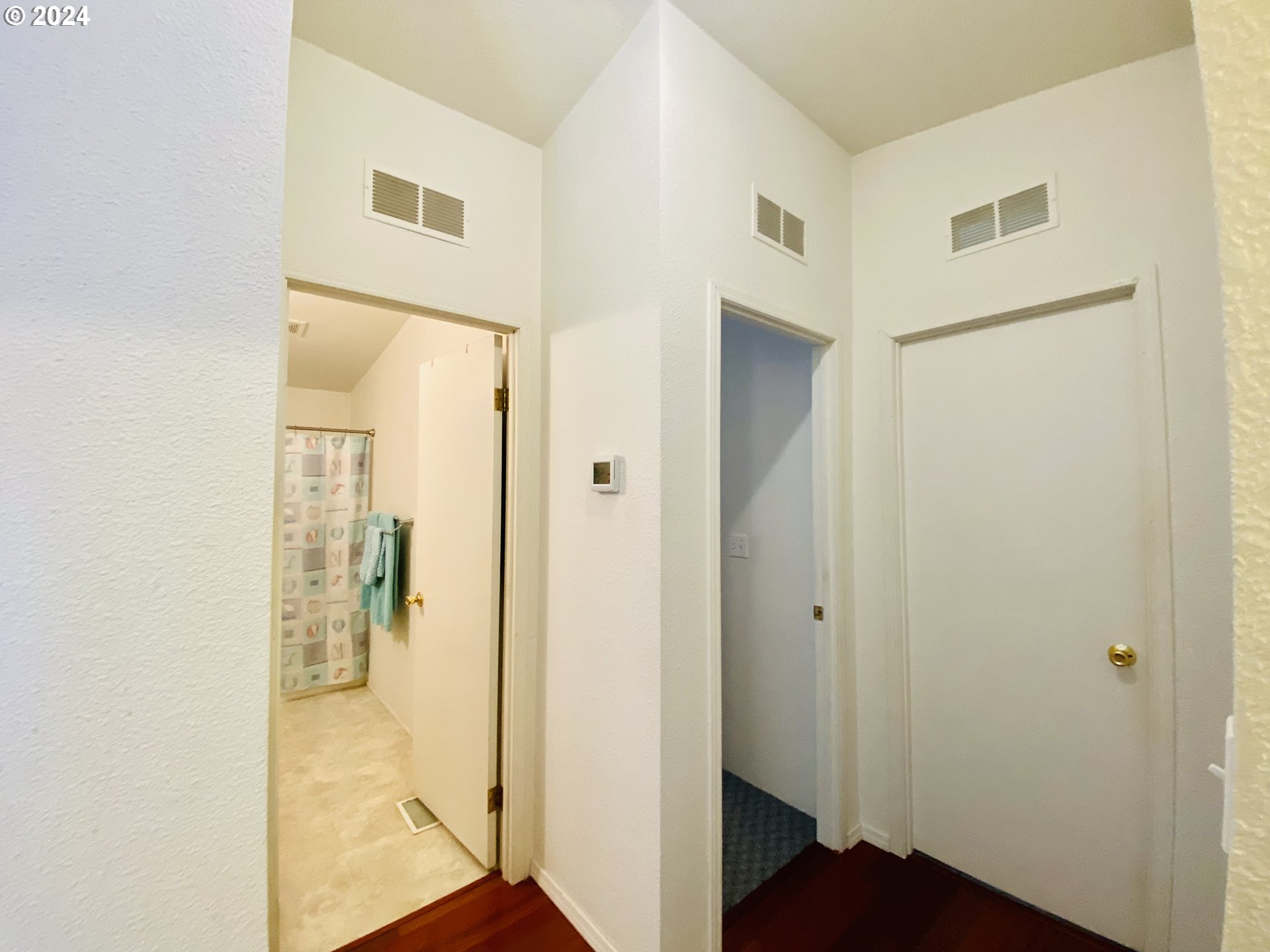 657 54th Street Springfield, OR 97478 - Photo 18 of 28 a view of a bathroom from a hallway